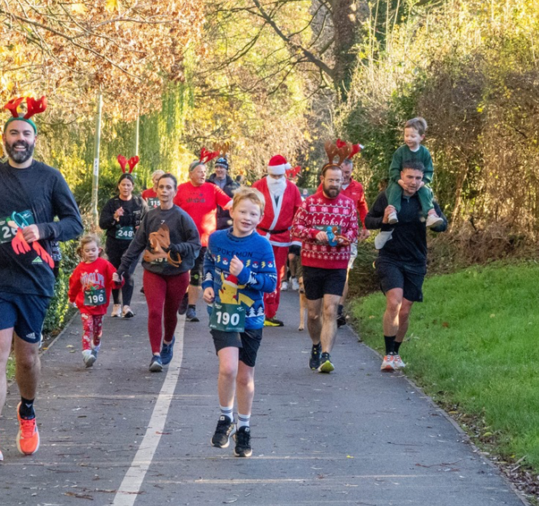 Group of people wearing reindeer antlers running the Reindeer Run 