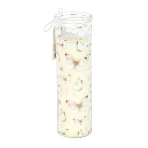 Tall white candle in clear glass holder decorated with light pink and tan butterflies.