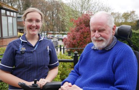 Ellie in her uniform at work with a patient