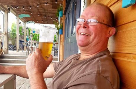 steve smiling drinking a beer