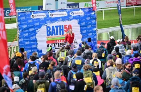 Large crowd of people warming up to take on the Bath 50 Ultra Challenge
