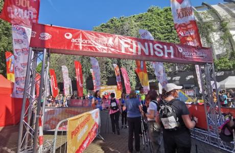 A crowd of people at the finish line of London Summer Walk