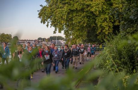 A crowd of people walking the Thames Bridge Trek