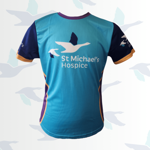 Teal, navy, and gold sports t-shirt with St Michael's Hospice goose logo.