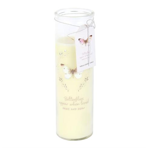 Cream-colored pillar candle in a glass jar with a butterfly motif and decorative tag.