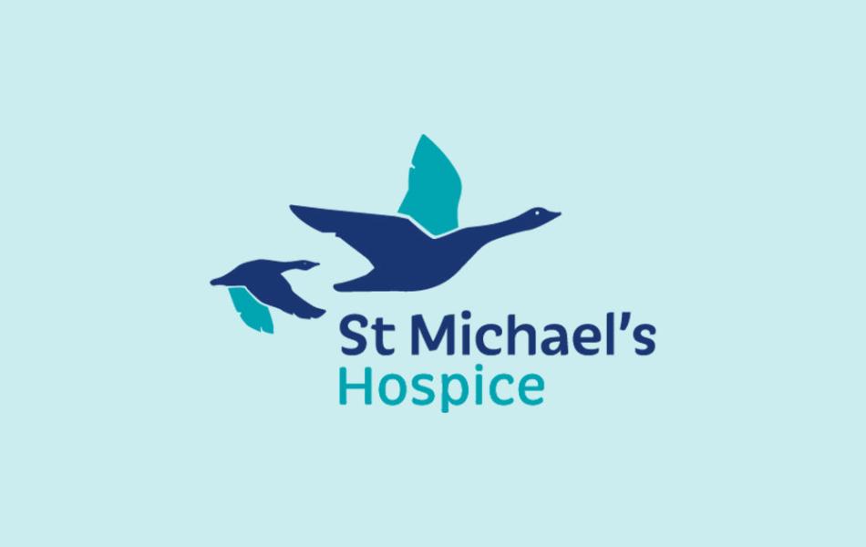 St Michael's Hospice logo with two blue and teal flying birds.