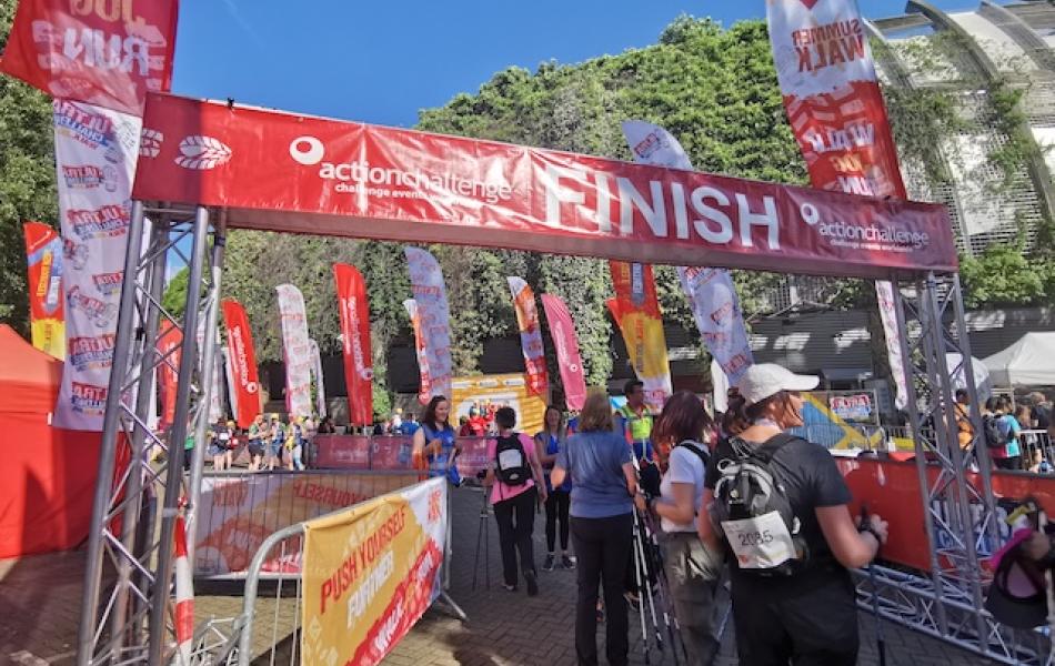 A crowd of people at the finish line of London Summer Walk