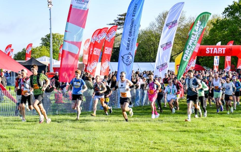 Crowd of people running at the start line of Windsor 50
