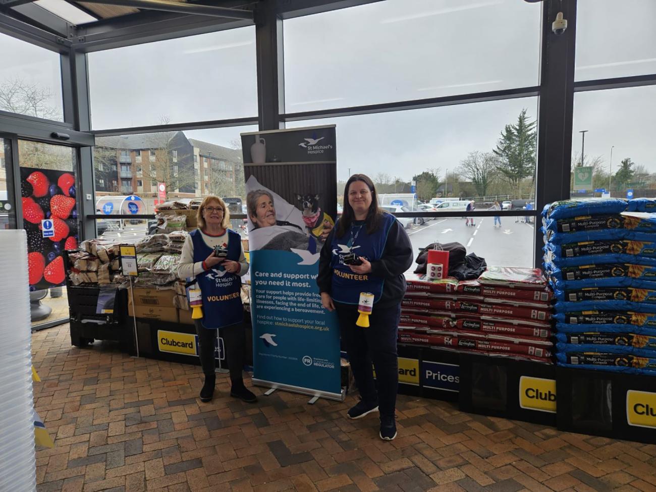 Two team members at Hook Tesco collecting for St. Michael's Hospice.