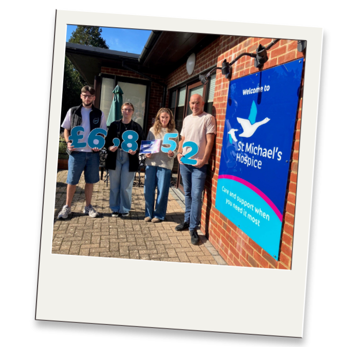 TPT Fire Maintenance outside our Hospice holding numbers for £8,852