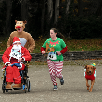 Reindeer Run participants with dog