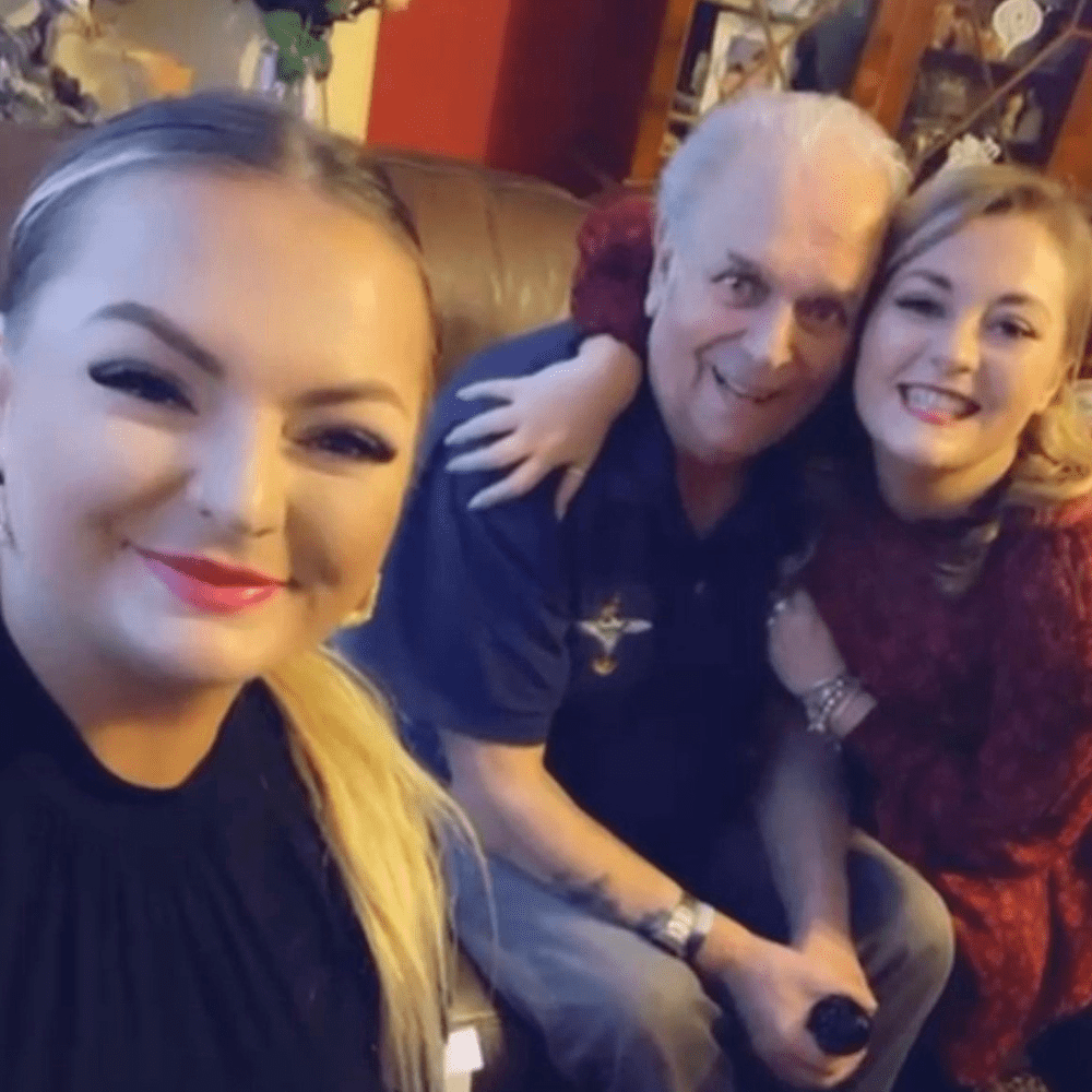 Jade and Amber with their Granda - all smiling at the camera