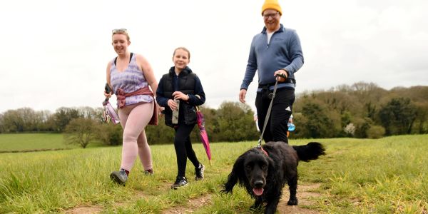 Family walking in Farleigh Wallop with their dog