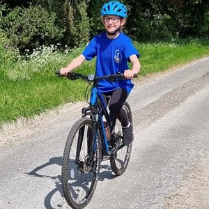 Sophie riding her bike in aid of the Hospice