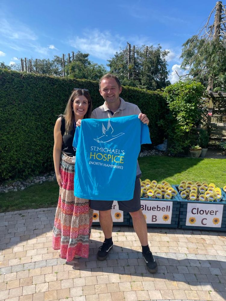 Image fo Graham and Sarah, holding a St. Michael's Hospice T-Shirt