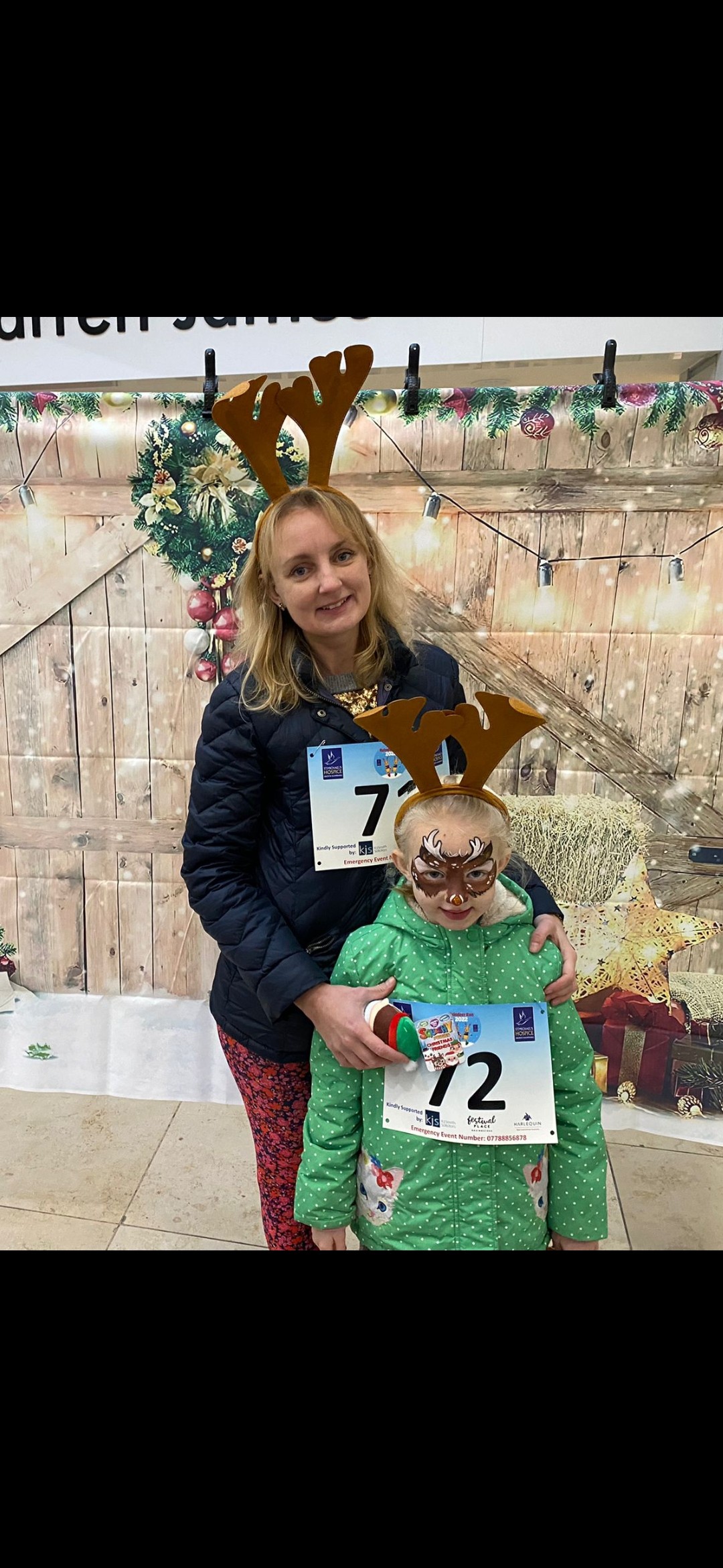image of Charlotte and her daughter wearing reindeer antlers at the reindeer run