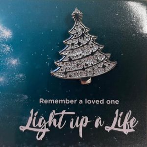 Image of a silver Christmas tree badge