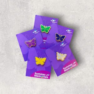 Photograph of coloured butterfly metal pin badges
