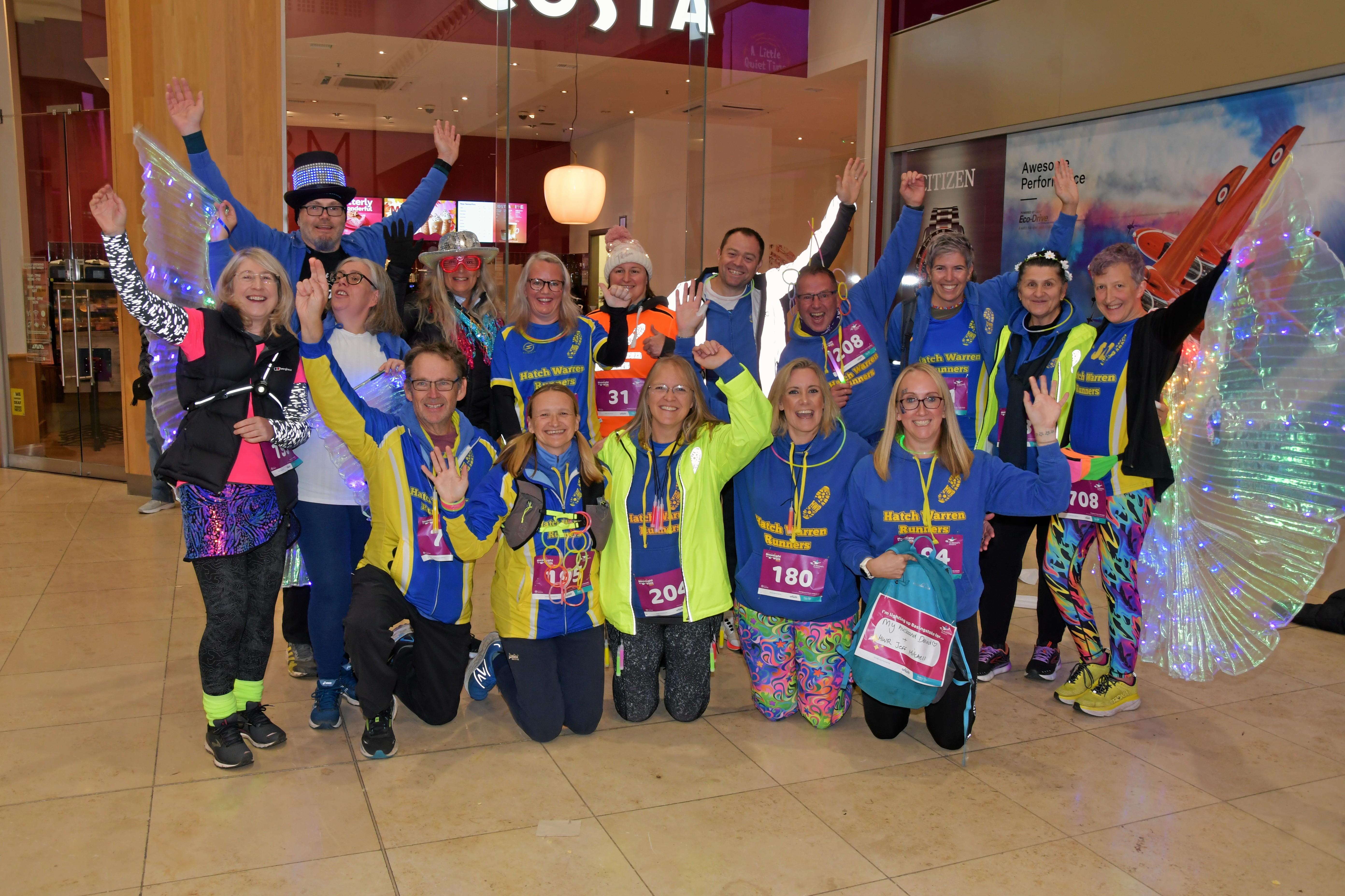 Photograph of a group of people wearing bright clothing about to do Moonlight Walk